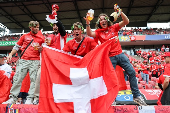 Swiss fans celebrate before a Group A match between Hungary and Switzerland at the Euro 2024 soccer tournament in Cologne, Germany, Saturday, June 15, 2024. (KEYSTONE/Peter Klaunzer)