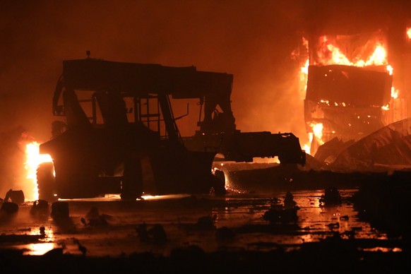 A fire rages at the BM Inland Container Depot, a Dutch-Bangladesh joint venture, in Chittagong, 216 kilometers (134 miles) southeast of capital, Dhaka, Bangladesh, early Sunday, June 5, 2022. Several  ...