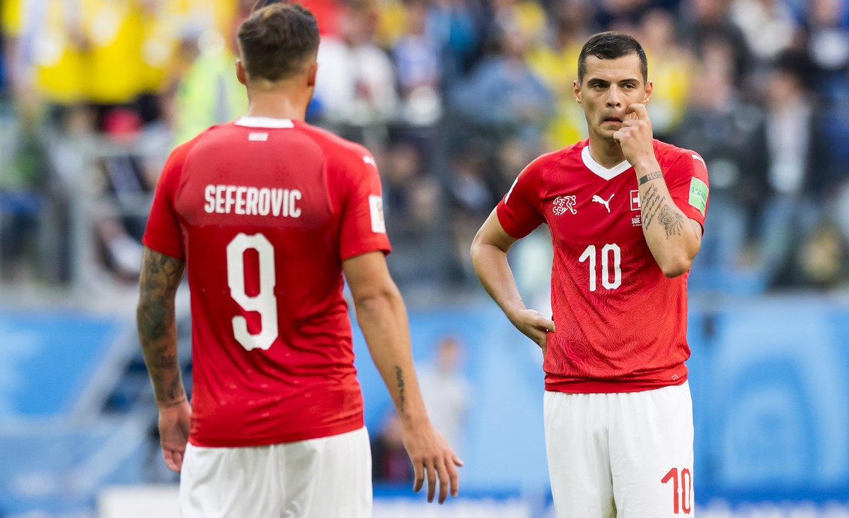 Switzerland's forward Haris Seferovic, left, and Switzerland's midfielder Granit Xhaka, right, react during the FIFA World Cup 2018 round of 16 soccer match between Sweden and Switzerland at ...