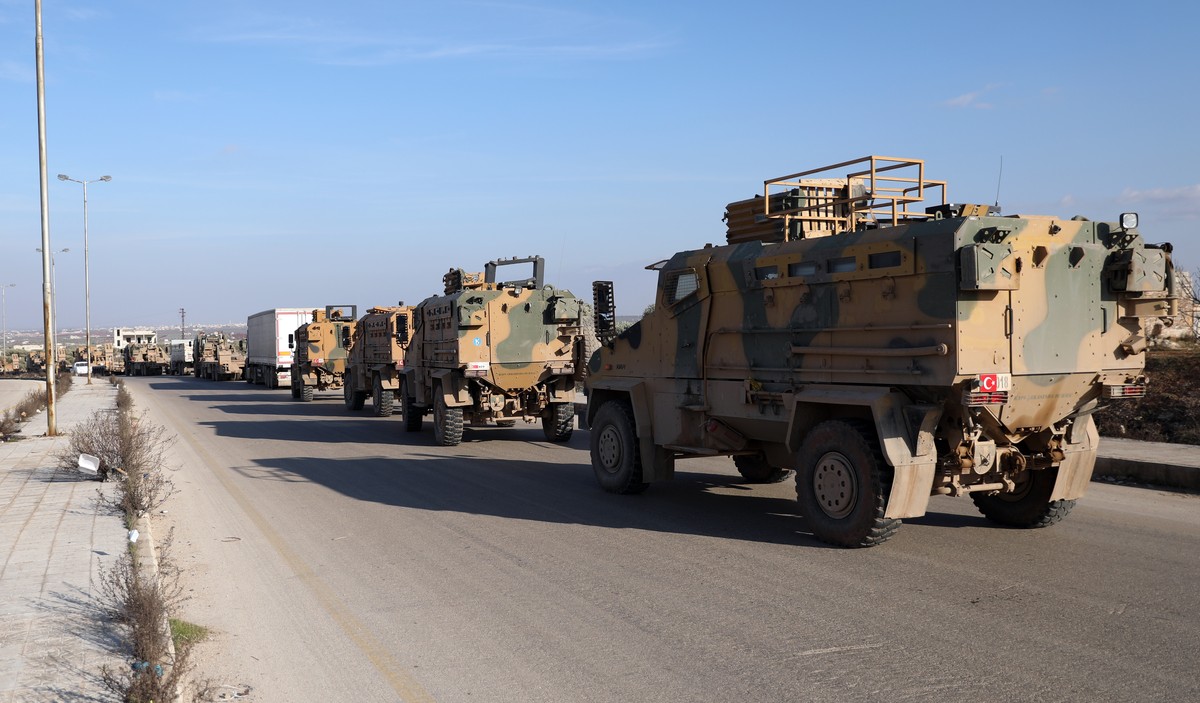 epa08230701 A Turkish military convoy moves east of Idlib, Syria, 20 February 2020. Turkish President Recep Tayyip Erdogan has said it is 'only a matter of time' before it launches an operat ...
