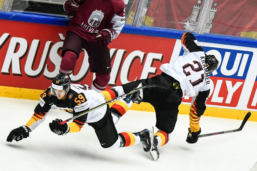 epa06729917 Manuel Wiederer (L) of Germany and Nicolas Krammer (R) of Germany in action during the IIHF World Championship group B ice hockey match between Latvia and Germany in Jyske Bank Boxen in He ...