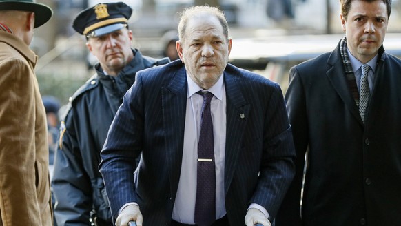 FILE - Harvey Weinstein arrives at a Manhattan courthouse as jury deliberations continue in his rape trial on Feb. 19, 2020, in New York. British prosecutors said Wednesday, June 8, 2022, they have au ...