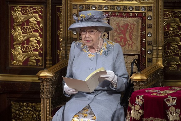 Britain&#039;s Queen Elizabeth II delivers the speech in the House of Lords during the State Opening of Parliament at the Palace of Westminster in London, Tuesday May 11, 2021. (Eddie Mulholland/Pool ...