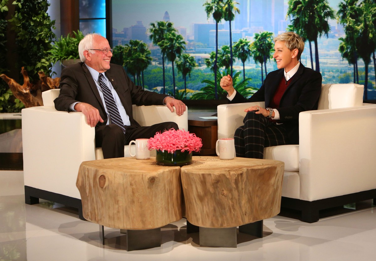 In this photo released by Warner Bros., talk show host Ellen DeGeneres, right, speaks with Democratic presidential candidate Sen. Bernie Sanders, of Vermont, during a taping of "The Ellen DeGener ...