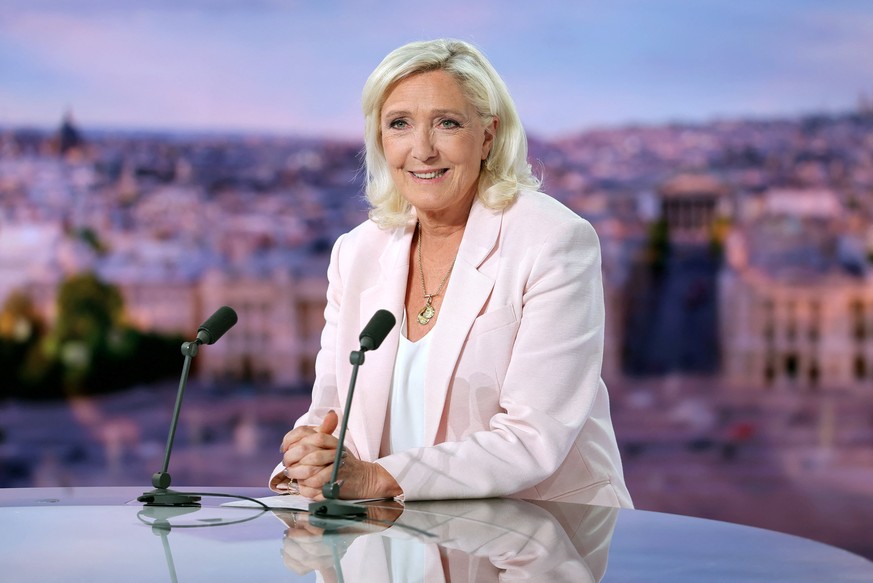 epa13096173 French far-right leader Marine Le Pen, member of parliament for the Rassemblement National (National Rally - RN) party, poses before an interview on the evening news broadcast of French TV ...