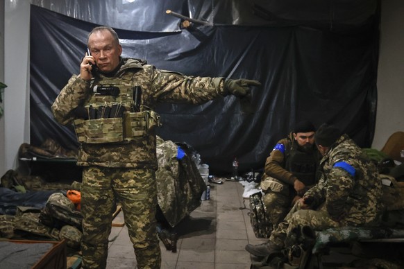 Commander of the Ukrainian army, Colonel General Oleksandr Syrskyi, gives instructions at a hideout in Soledar, the site of heavy fighting with Russian forces, in the Donetsk region, Ukraine, Sunday, January 1…