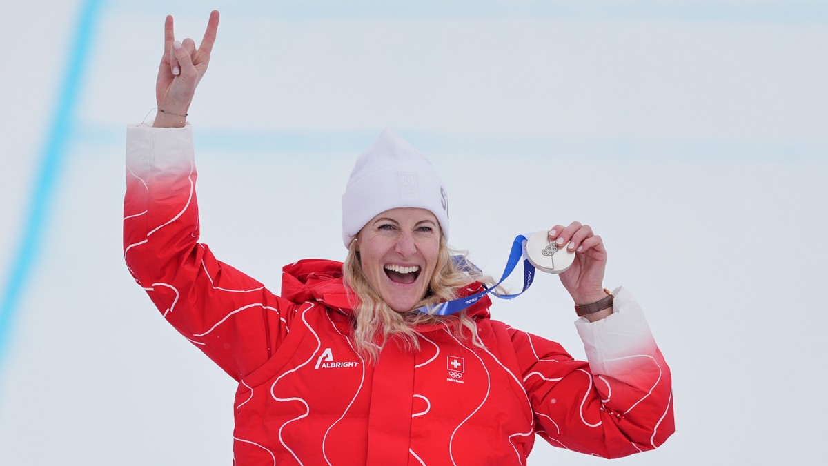 Silver medalist Switzerland's Fanny Smith (3) celebrates after the women's ski cross finals at the 2026 Winter Olympics, in Livigno, Italy, Friday, Feb. 20, 2026. (AP Photo/Rebecca Blackwell ...