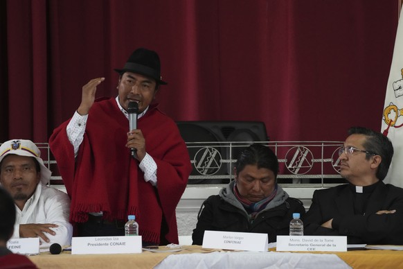 Indigenous leader Leonidas Iza speaks during a dialogue session with the government, with Catholic Church representatives as mediador, at the Episcopal Conference headquarters in Quito, Ecuador, Thurs ...