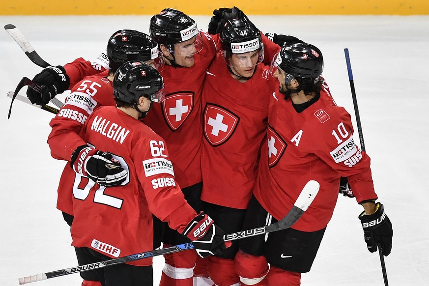 Switzerland&#039;s Denis Malgin, Romain Loeffel, Joel Genazzi, Pius Suter and Andres Ambuehl, from left, celebrate their second goal during their Ice Hockey World Championship group B preliminary roun ...
