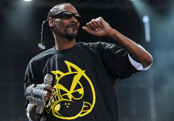 FILE -- In a July 7, 2011 file photo, US hip-hop artist Snoop Dogg performs on stage at the Balaton Sound festival in Zamardi, Hungary. On Monday, April 20, 2015, singer Willie Nelson joined the list  ...