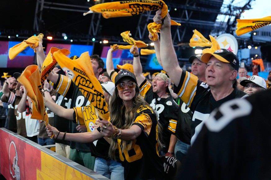 Pittsburgh Steelers fans cheer during the first round of the NFL football draft, Thursday, April 23, 2026, in Pittsburgh. (AP Photo/Sue Ogrocki)
NFL Draft Football