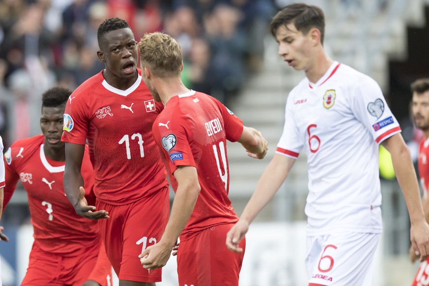 Switzerland&#039;s midfielder Denis Zakaria, left no17, celebrates after scoring the 1 - 0 with Switzerland&#039;s defender Nico Elvedi, center, and in front of Gibraltar&#039;s midfielder Louie Annes ...