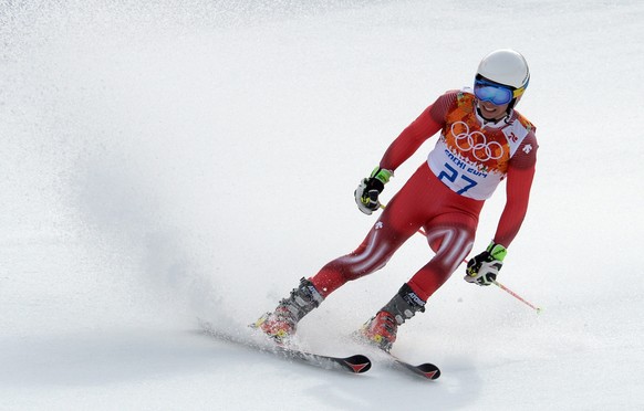 epa04087259 Gino Caviziel of Switzerland in action during the Men&#039;s Giant Slalom race at the Rosa Khutor Alpine Center during the Sochi 2014 Olympic Games, Krasnaya Polyana, Russia, 19 February 2 ...