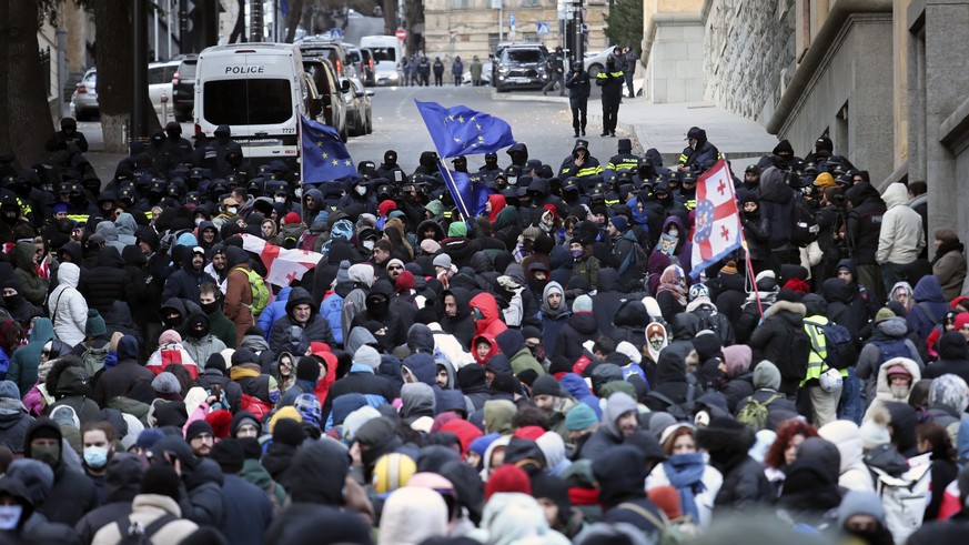 epa11776037 Supporters of the opposition attend a protest in front of the parliament building during presidential elections in Tbilisi, Georgia, 14 December 2024. For the first time in Georgia, the pr ...