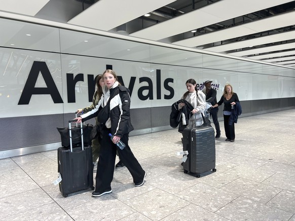 Passengers in the arrivals hall at Heathrow Terminal 5 in London, Saturday March 22, 2025, after flights resumed at the airport. (Maja Smiejkowska/PA via AP)
Britain Heathrow Disruption