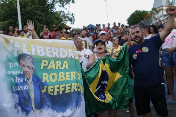 Supporters of former lawmaker Roberto Jefferson protest against his arrest next to his house in Levy Gasparian, Rio de Janeiro state, Brazil, Sunday, Oct. 23, 2022. Jefferson, an ally of Brazilian Pre ...
