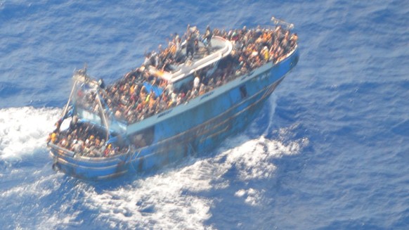 epa10691107 A handout photo provided by the Hellenic Coast Guard on 14 June 2023 shows a fishing vessel carrying a large number of migrants in international waters near the western Peloponnese ...