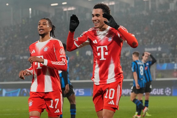 Bayern's Jamal Musiala and team mate Michael Olise celebrates after scoring his side's sixth goal during the Champions League round of 16 soccer match between Atalanta and FC Bayern Munich i ...