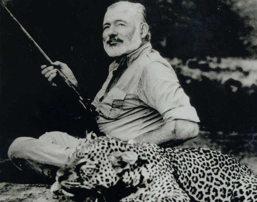 Ernest Hemingway poses with a dead leopard in this 1953 photo from an exhibit celebrating the centennial of the author&#039;s birth, on display at Washington&#039;s National Portrait Gallery through N ...