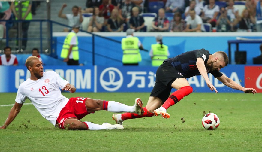 epa06856636 Ante Rebic (R) of Croatia is fouled by Mathias Jorgensen (L) of Denmark in the penalty box during the FIFA World Cup 2018 round of 16 soccer match between Croatia and Denmark in Nizhny Nov ...