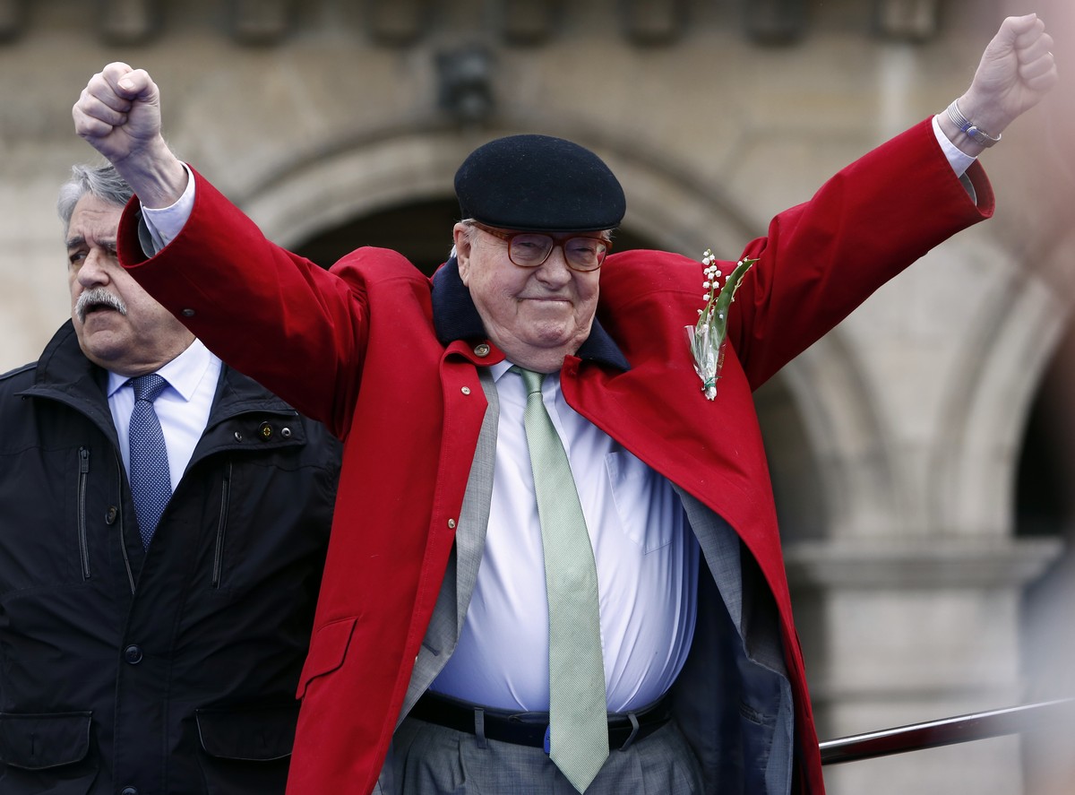 FILE - In this May 1, 2017 file photo, former far-right National Front party leader Jean-Marie Le Pen reacts the statue of Joan of Arc, in Paris. French far-right leader Marine Le Pen is coming under  ...