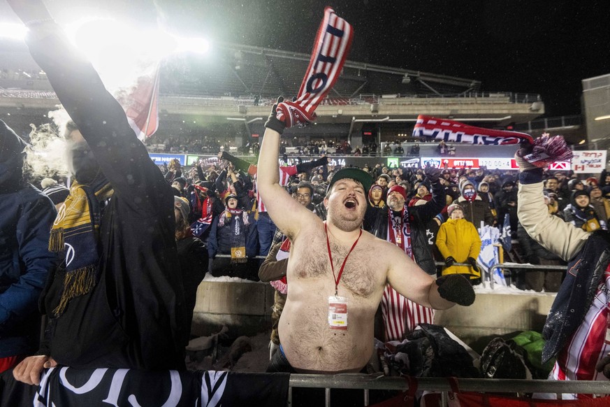 November 9, 2025, Ottawa, On, Canada: An Atletico Ottawa fan celebrates his teamsöÄÃ victory over over Cavalry FC following extra time during the Canadian Premier League finals soccer action in Ottawa ...