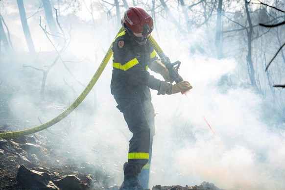 This photo provided by the Securite Civile on Friday, Aug.8, 2025 shows a firefighter battling wildfire on Thursday, Aug. 7, 2025 near Jonquieres, southern France. (Securite Civile via AP)
France Fire ...