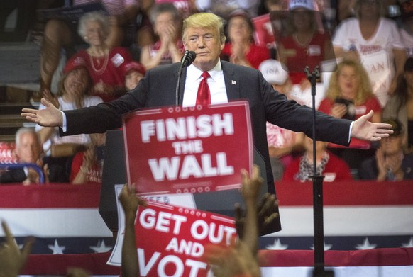 epaselect epa07134342 US President Donald J. Trump speaks during the Make America Great Again Rally in Hertz Arena, Fort Myers, Florida, 31 October 2018. Trump holds a national midterm campaign tour w ...