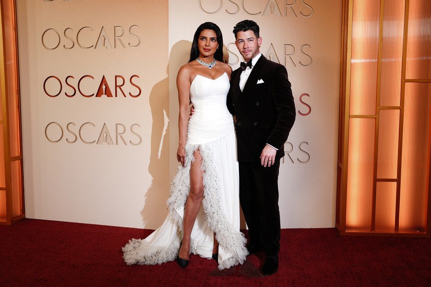 Priyanka Chopra, left, and Nick Jonas arrive at the Oscars on Sunday, March 15, 2026, at the Dolby Theatre in Los Angeles. (Photo by Jordan Strauss/Invision/AP)
Priyanka Chopra,Nick Jonas