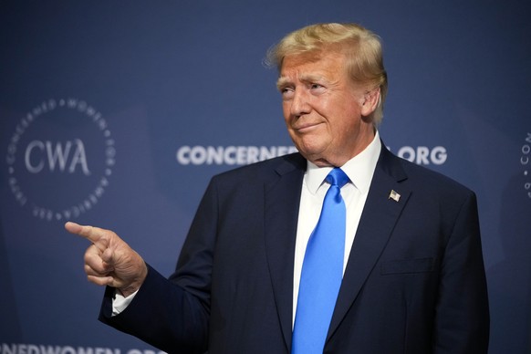 Former President Donald Trump points to the crowd as he arrives to speak at a Concerned Women for America Summit at the Capitol Hilton, Friday, Sept. 15, 2023, in Washington. (AP Photo/Andrew Harnik)
 ...