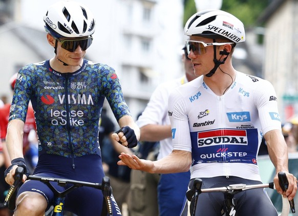 Tour de France 2024 - Stage 12 VILLENEUVE-SUR-LOT, FRANCE - JULY 11 : Vingegaard Hansen Jonas DEN of Team Visma Lease a Bike and Evenepoel Remco BEL of Soudal - Quick Step during stage 12 of the 111th ...