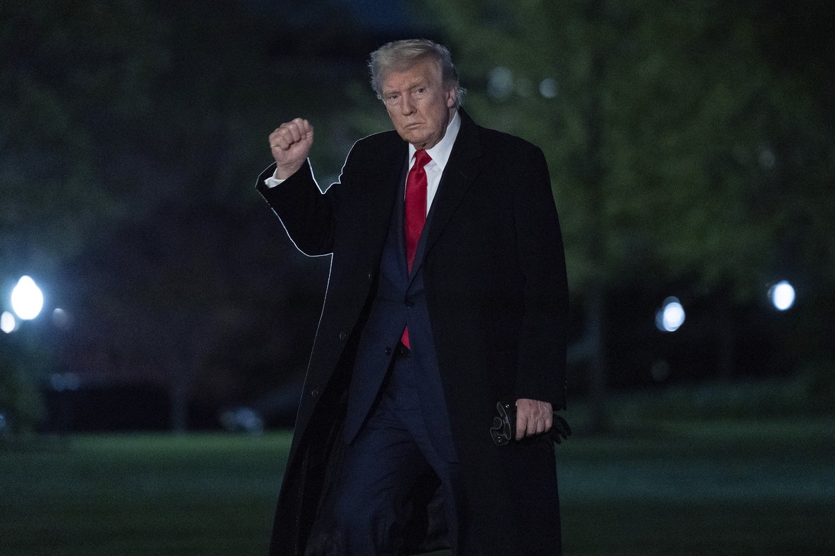 President Donald Trump gestures to reporters as he walks on the South Lawn of the White House in Washington, Sunday, April 13, 2025. (AP Photo/Jose Luis Magana)
Trump