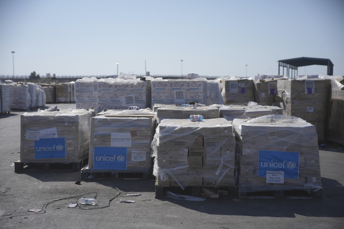 Piles of humanitarian aid packages from UNICEF wait to be picked up on the Palestinian side of the Kerem Shalom crossing in the Gaza Strip, Thursday, July 24, 2025. during a media tour organized by th ...