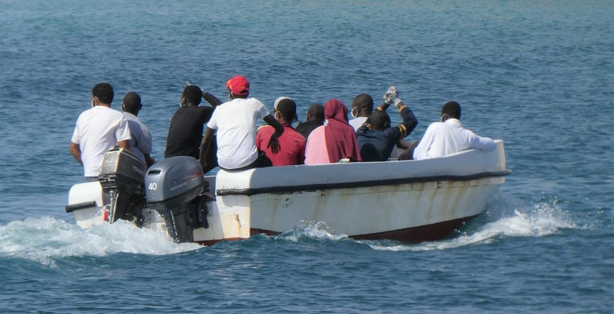 epa08616256 Migrants land in Lampedusa, Sicily, Italy, 21 August 2020. There are currently 1,400 migrants on Lampedusa after five more landings on the stepping-stone island between Italy and North Afr ...