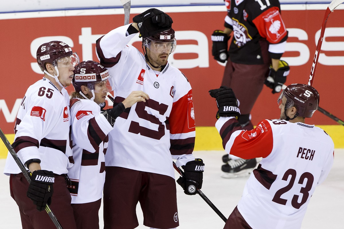 Sparta's Tomas Netik, 2nd left, celebrates his goal withe teammates Michal Cajkovsky, left, Petr Kumstat, 2nd right, and Lukas Pech, right, after scored the 0:1, during the Champions Hockey Leagu ...