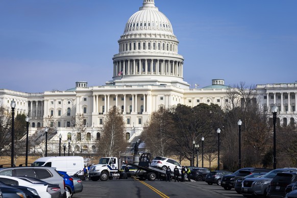 epa12751242 US Capitol Police tow a vehicle outside the US Capitol near where a man was arrested with what police said appeared to be a gun in Washington, DC, USA, 17 February 2026. Capitol Police sta ...