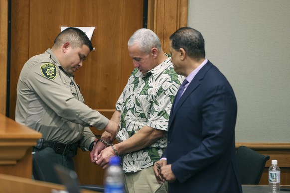 A bailiff removes Albert "ian" Schweitzer's handcuffs following the judge's decision to release him from prison, immediately after his lawyers presented new evidence at a hearing Tuesday…