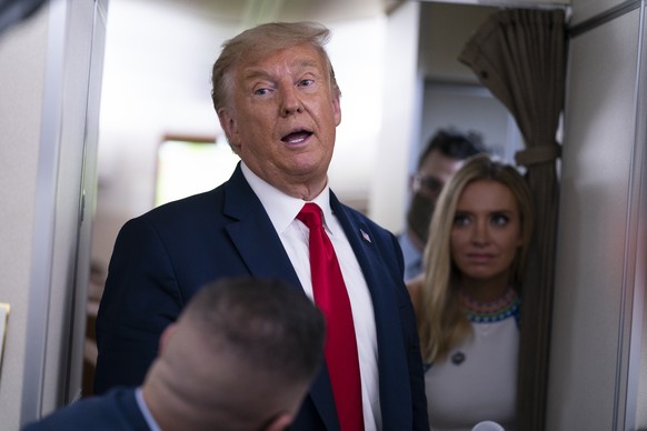 President Donald Trump talks with reporters after leaving a campaign rally at Pensacola International Airport, Friday, Oct. 23, 2020, aboard Air Force One. (AP Photo/Evan Vucci)
Donald Trump