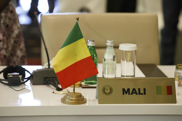 The seat of the representative of Mali stands empty during the fifth extraordinary summit in Accra, Ghana, Friday March 25, 2022. West African leaders held another summit on Mali after imposing region ...