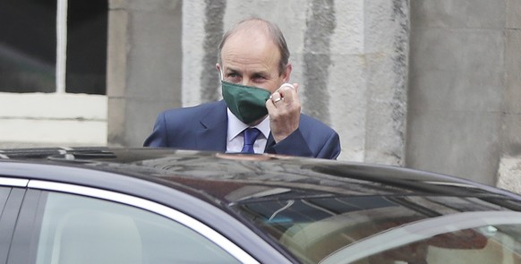 Irish Prime Minister Micheal Martin arrives for a Cabinet meeting at Dublin Castle, Ireland, Monday July 6, 2020. Centrist politician Micheal Martin leads a coalition government of two longtime rival  ...