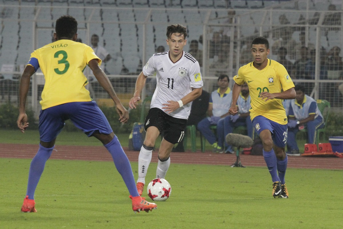Brazil's Vitao Eduardo duels for the ball against Germany's Nicolas Kuehn during their FIFA U-17 World Cup quarter final match in Kolkata, India, Sunday, Oct. 22, 2017. (AP Photo/Bikas Das)