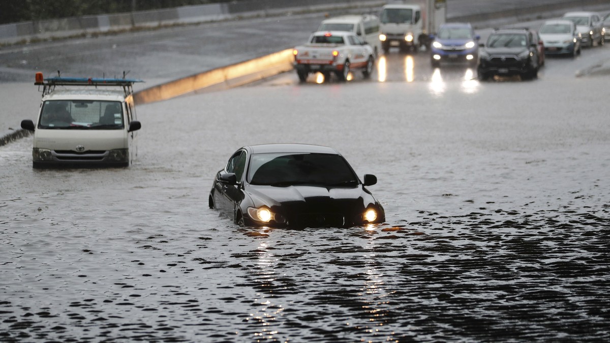 Vehicles are stranded by flood water in Auckland, Saturday, Jan 28, 2023. Record levels of rainfall pounded New Zealand's largest city, causing widespread disruption. (Dean Purcell/New Zealand He ...
