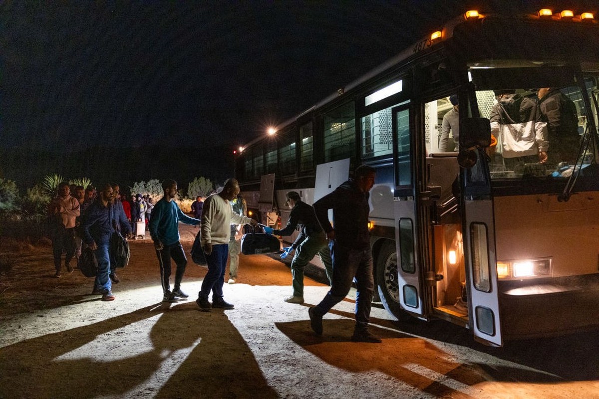 JACUMBA HOT SPRINGS, CA - JUNE 24: Migrants are processed by U.S. Border Patrol agents after crossing into the U.S. from Mexico through an abandoned railroad on June 24, 2024 in Jacumba Hot Springs, S ...