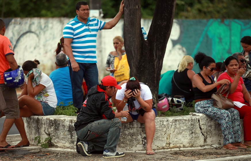 Relatives of prisoners await news in front of the Medical Legal Institute (IML) after the end of a bloody prison riot in the Amazon jungle city of Manaus, Brazil January 2, 2017. REUTERS/Michael Danta ...