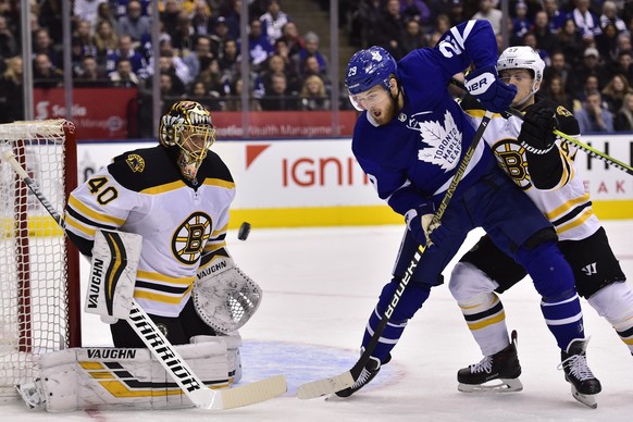 Toronto Maple Leafs right wing William Nylander (29) and Boston Bruins goaltender Tuukka Rask (40) watch the puck as Boston Bruins defenseman Torey Krug (47) defends during the first period of an NHL  ...