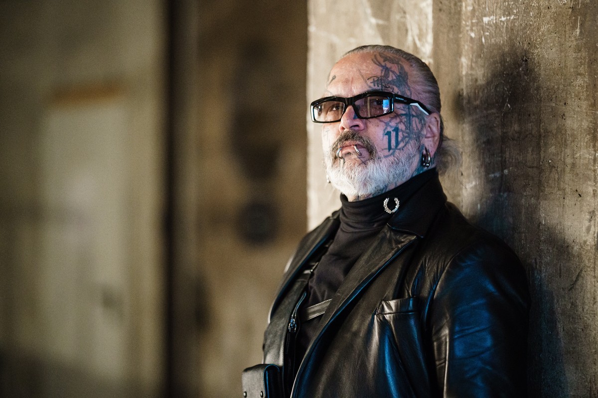 epa09827555 German photographer and doorman of Berlin's techno music club Berghain, Sven Marquardt poses for the photographer prior to a visit to the runway show of German designer Esther Perband ...