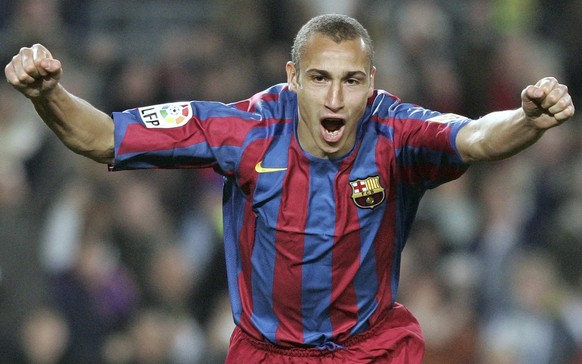 Barcelona player Henrik Larsson, from Sweden, celebrates his goal against Alaves during a Spanish league soccer match in Barcelona, Spain, Sunday, Jan. 22, 2006. (AP Photo/Manu Fernandez)