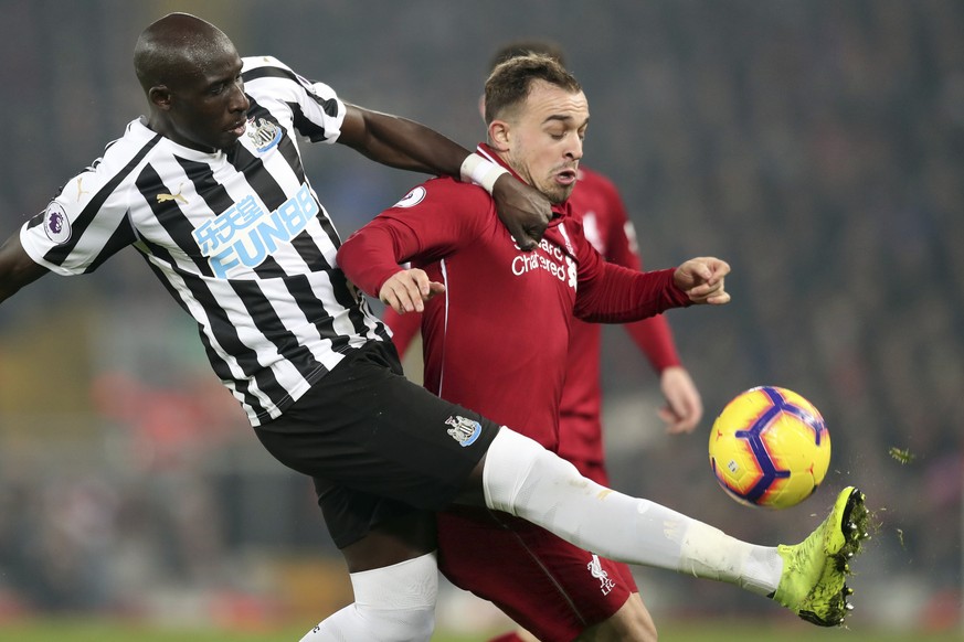 Newcastle&#039;s Mohamed Diame, left, and Liverpool&#039;s Xherdan Shaqiri vie for the ball during the English Premier League soccer match between Liverpool and Newcastle at Anfield Stadium, Liverpool ...