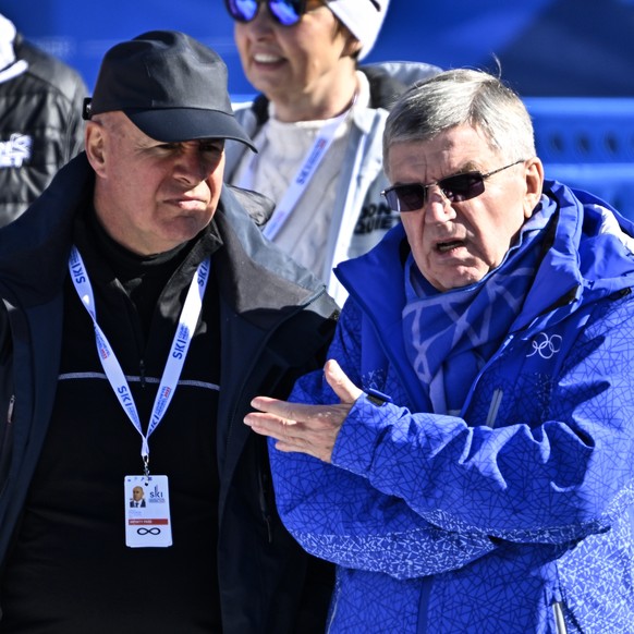 Johan Eliasch, president FIS, left, and Thomas Bach, president IOC react in the finish area during the women&#039;s downhill race at the 2023 FIS Alpine Skiing World Championships in Courchevel/Meribe ...