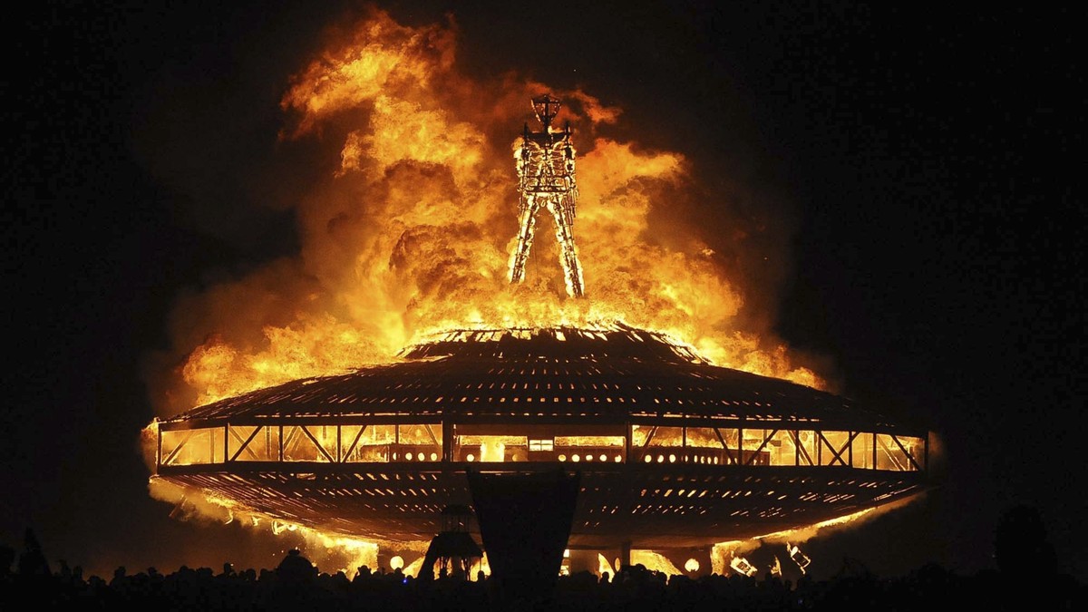 FILE - In this Aug. 31, 2013, file photo, the "Man" burns on the Black Rock Desert at Burning Man near Gerlach, Nev. A Nevada sheriff says the man who ran into the flames at the Burning Man  ...